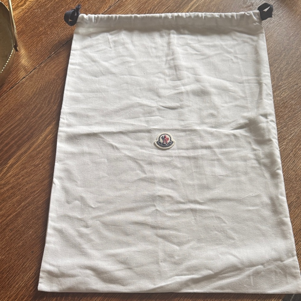 Moncler dust bag.  Cream Drawstring Bag
